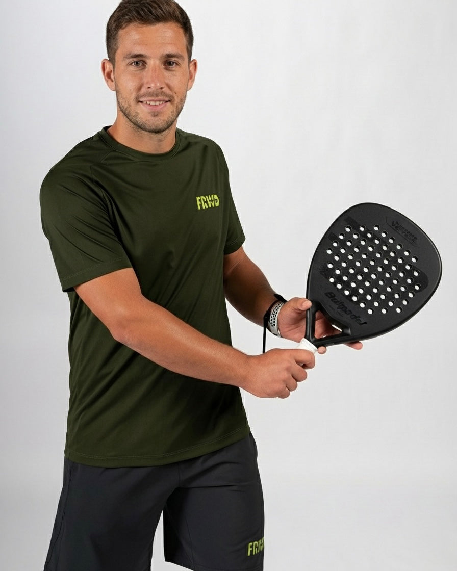 Man holding a black paddle with a white logo on a gray background